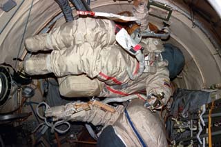 Views of the Mir space station airlock including Orlan suits. 